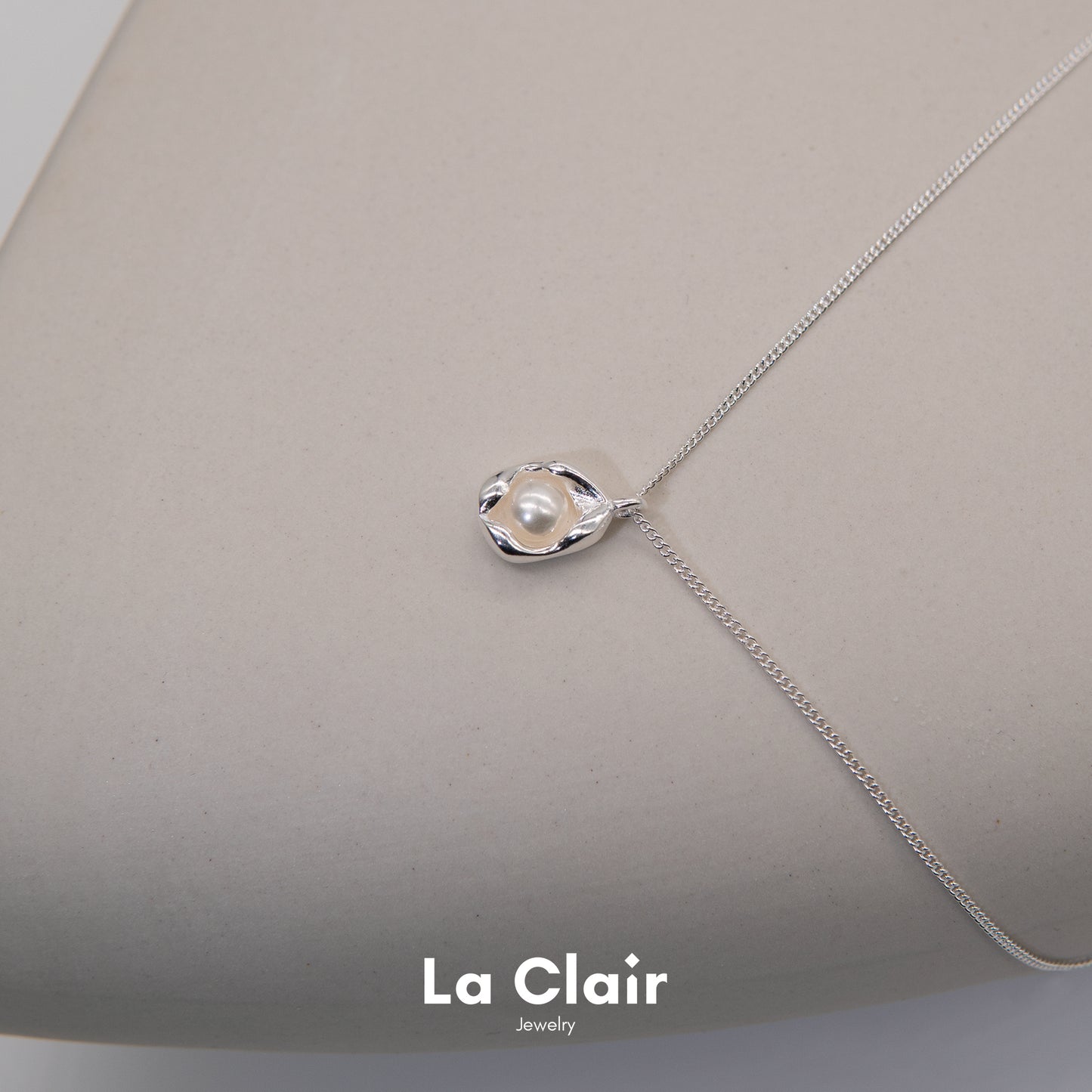 Silver Pearl-Adorned Egg Shape Necklace