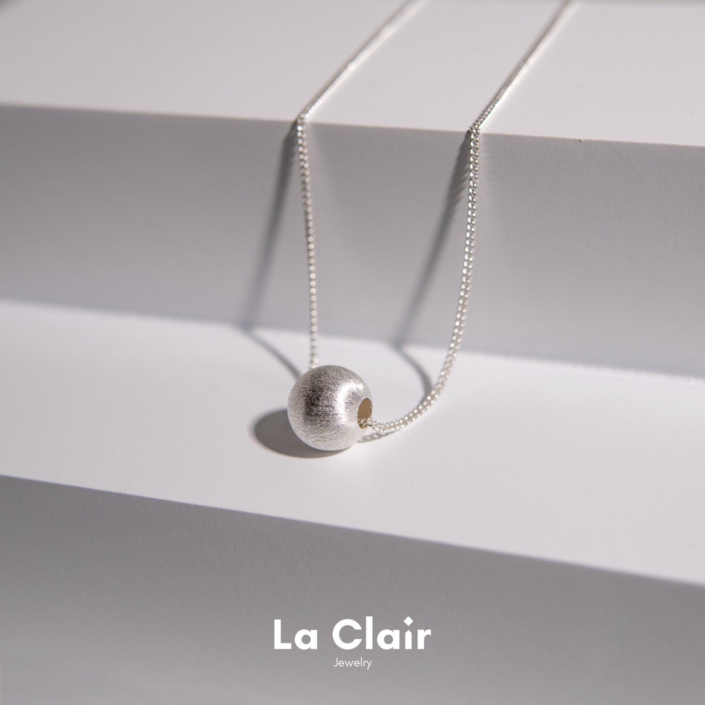 Silver Textured Sphere Pendant Necklace